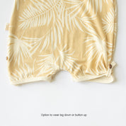 multi wearing baby playsuit yellow palm tree