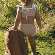 back view of kids organic cotton rust backpack
