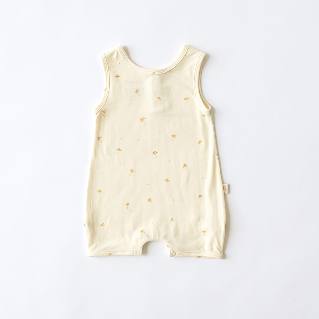 cream baby playsuit onesie with palm tree and moon pattern