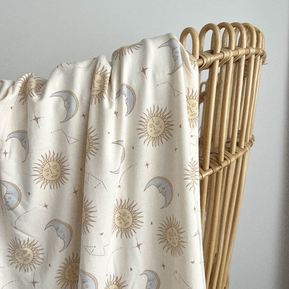 Celestial suns and moon baby swaddle