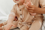 Short sleeve baby Jumpsuit with all over palm print in honey colour by Bam Loves Boo