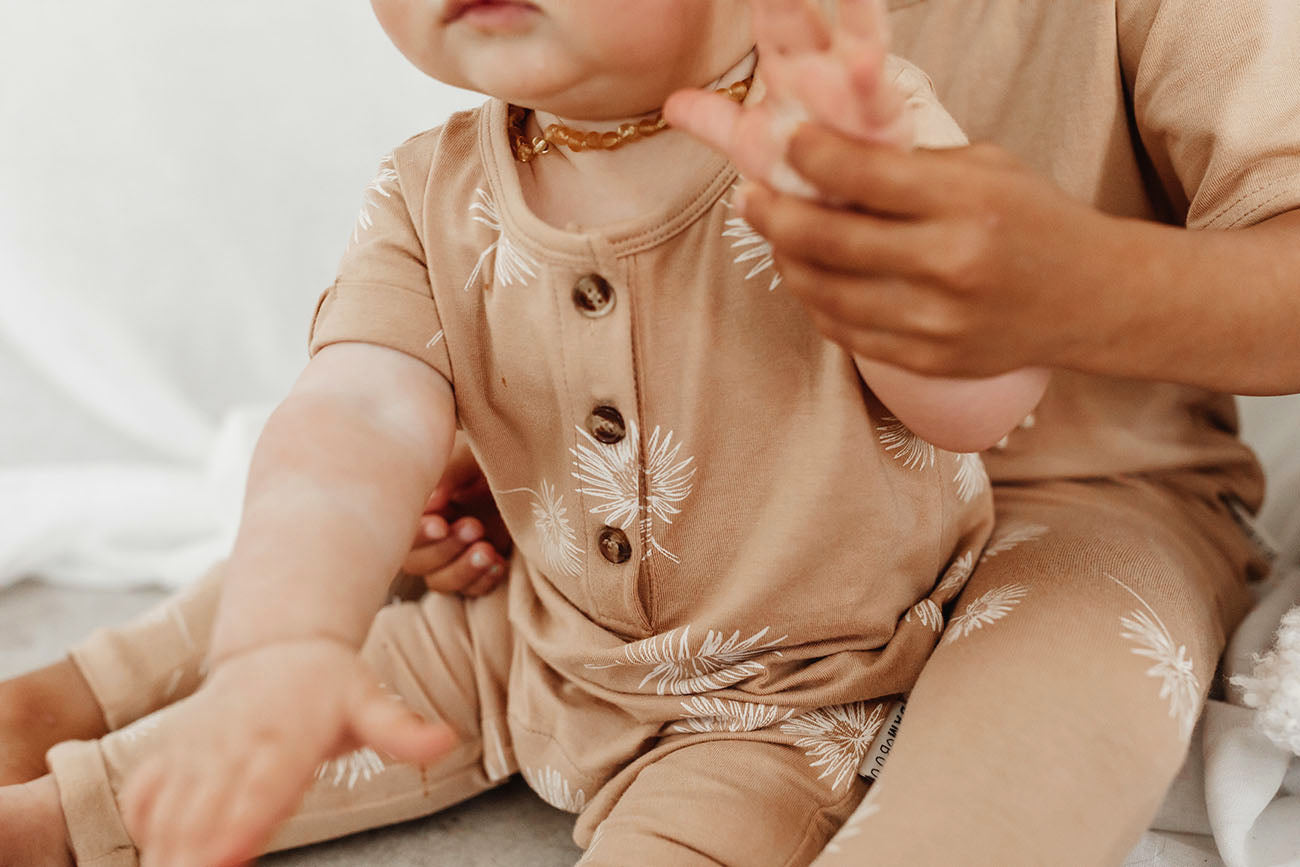 Short sleeve baby Jumpsuit with all over palm print in honey colour by Bam Loves Boo