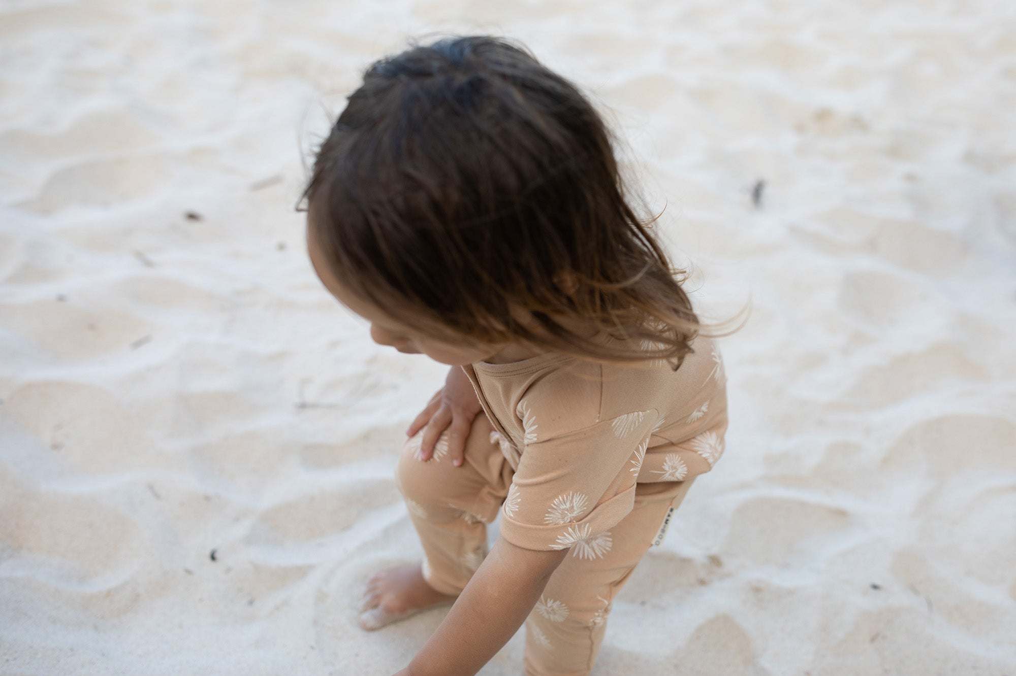 Short sleeve baby Jumpsuit with all over palm print in honey colour by Bam Loves Boo