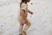 Short sleeve baby Jumpsuit with all over palm print in honey colour by Bam Loves Boo