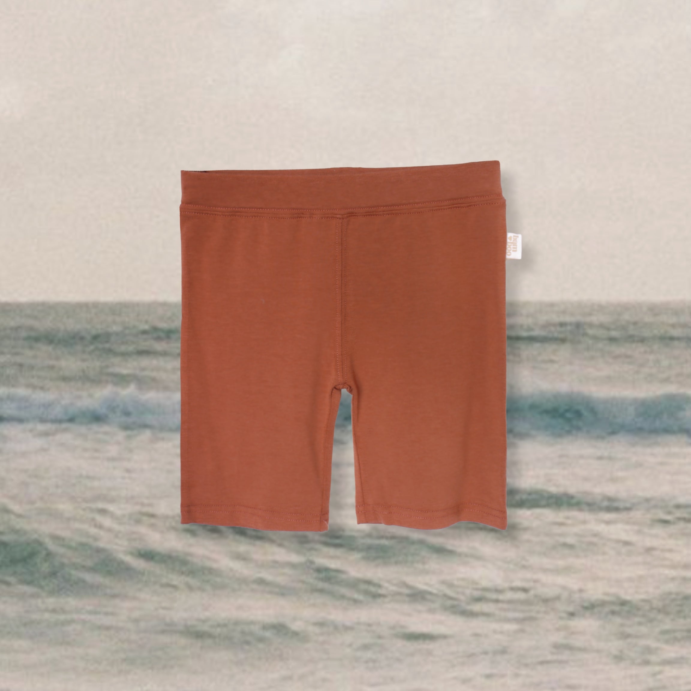 rust-bike-pants-kids-ocean-background