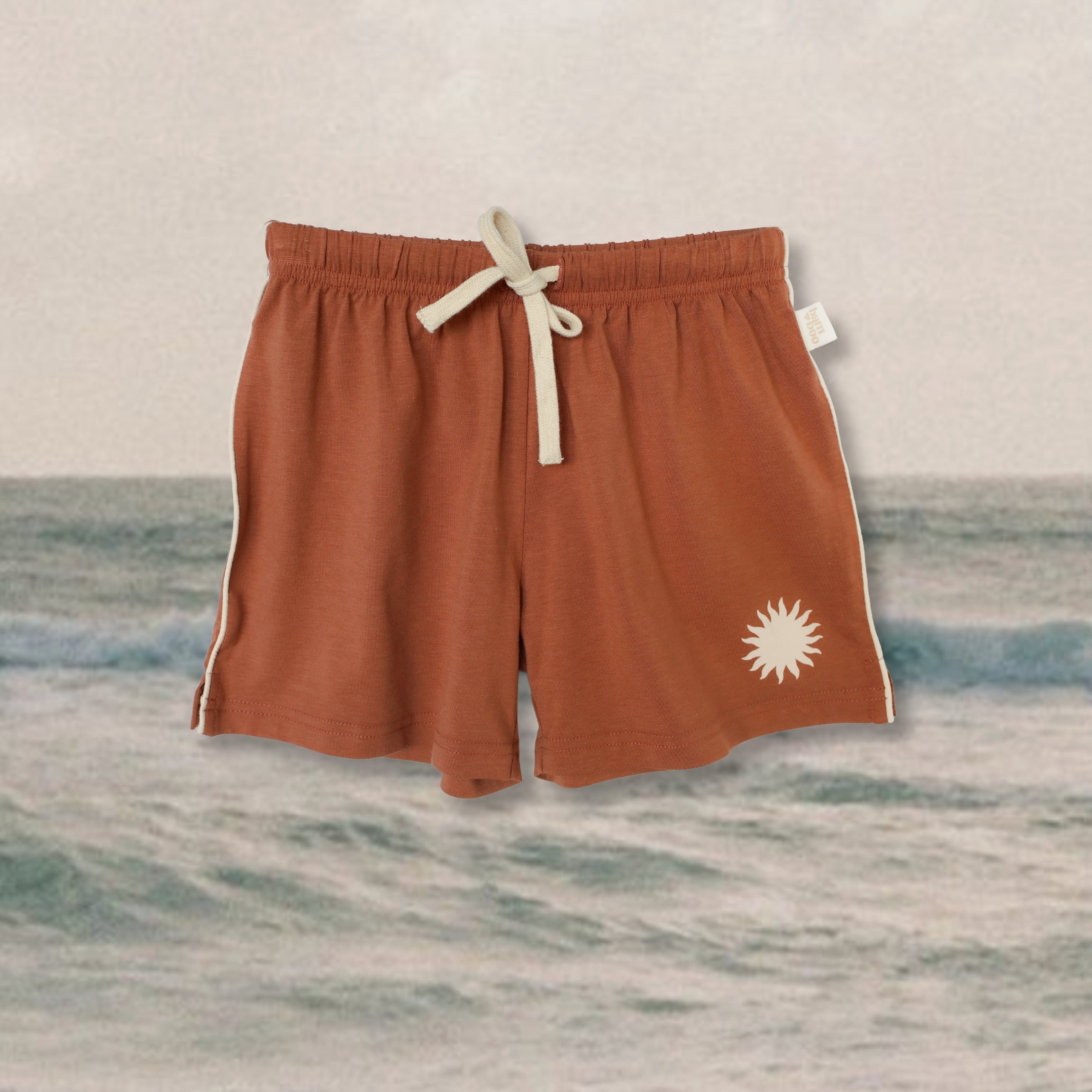 rust-kids-bamboo-shorts-with-sun-print-leg