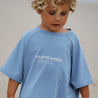 Kids Blue bamboo tee with beachcomber print on the front