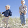 children in bam loves boo kids clothes on beach