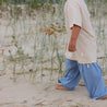 Child wearing bamboo cream tee and blue wide leg pants