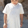 Cream kids tee with printed palm tree pattern