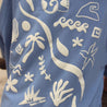 Back printed shells, palm tree, waves, sun and moon print on blue tee