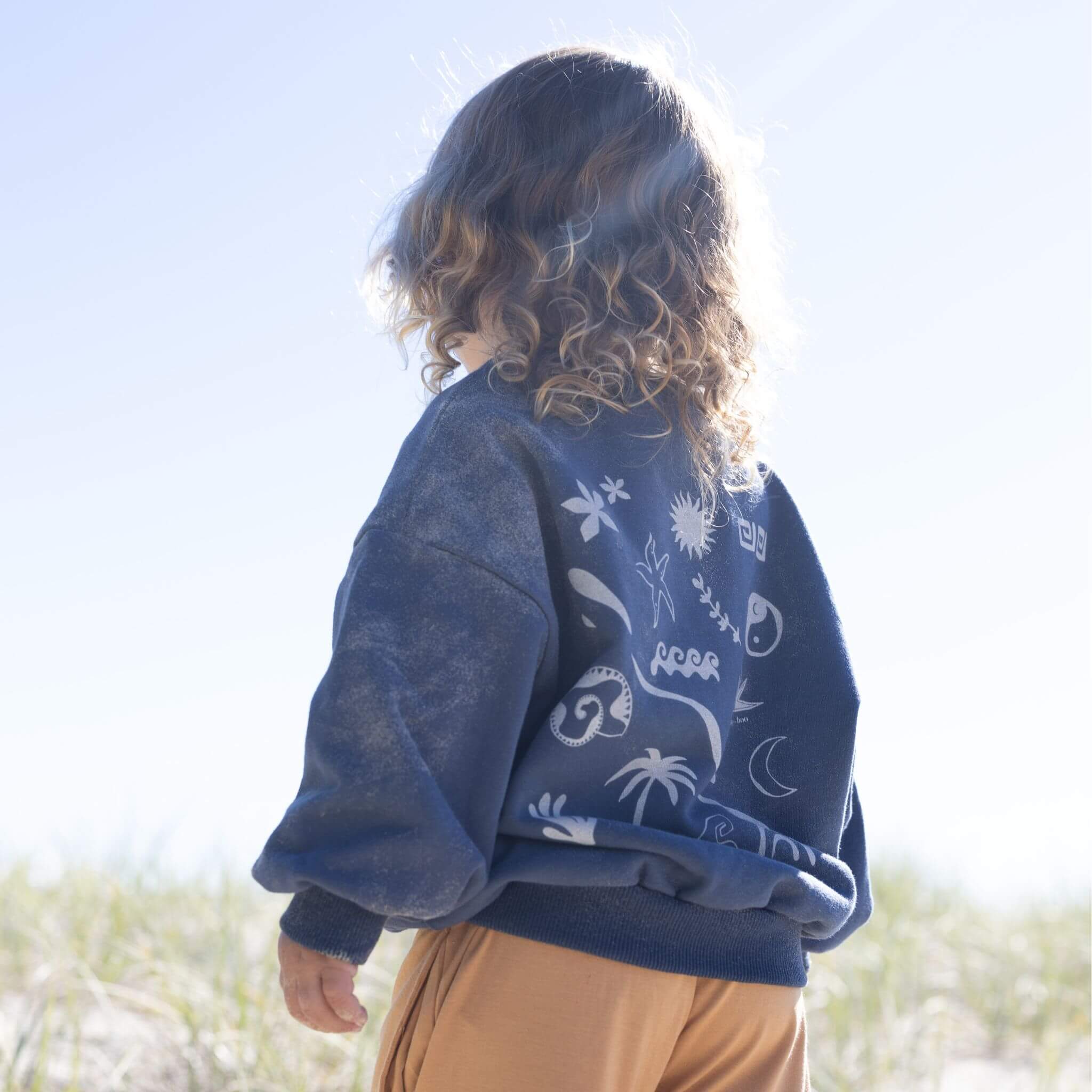 Navy childs jumper with back print and beach icons bam loves boo