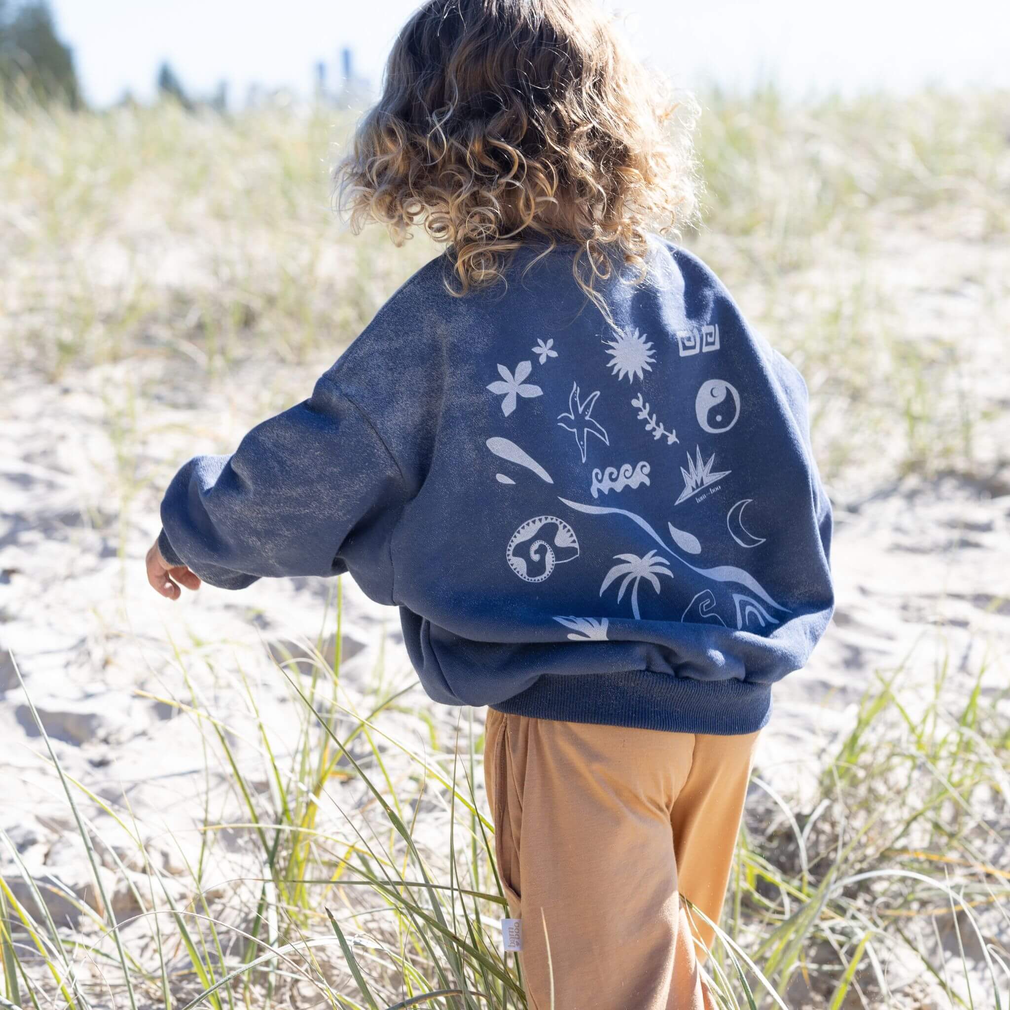 navy Kids jumper with back print and beach icons