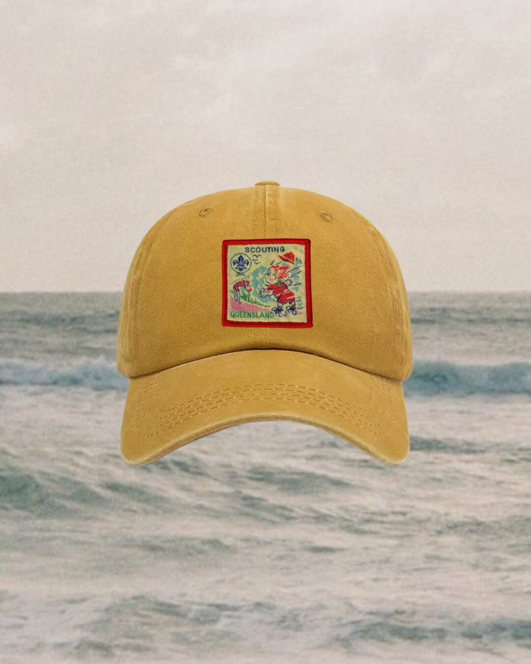 Yellow cap with a colorful patch on a water background