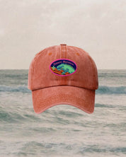 90's kids red cap with scout badge on ocean backdrop