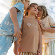Close up of the Beachcomber print on the back of a tan tee by Bam Loves Boo