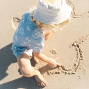 Kids running hand in hand in Kailani print pyjama sets by Bam Loves Boo