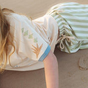 Close up of the sleeve print detail on the cream Kailani raglan tee by Bam Loves Boo