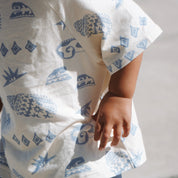 Close-up of Kailani kids tee showing soft fabric, detailed ocean-themed print, and natural movement.