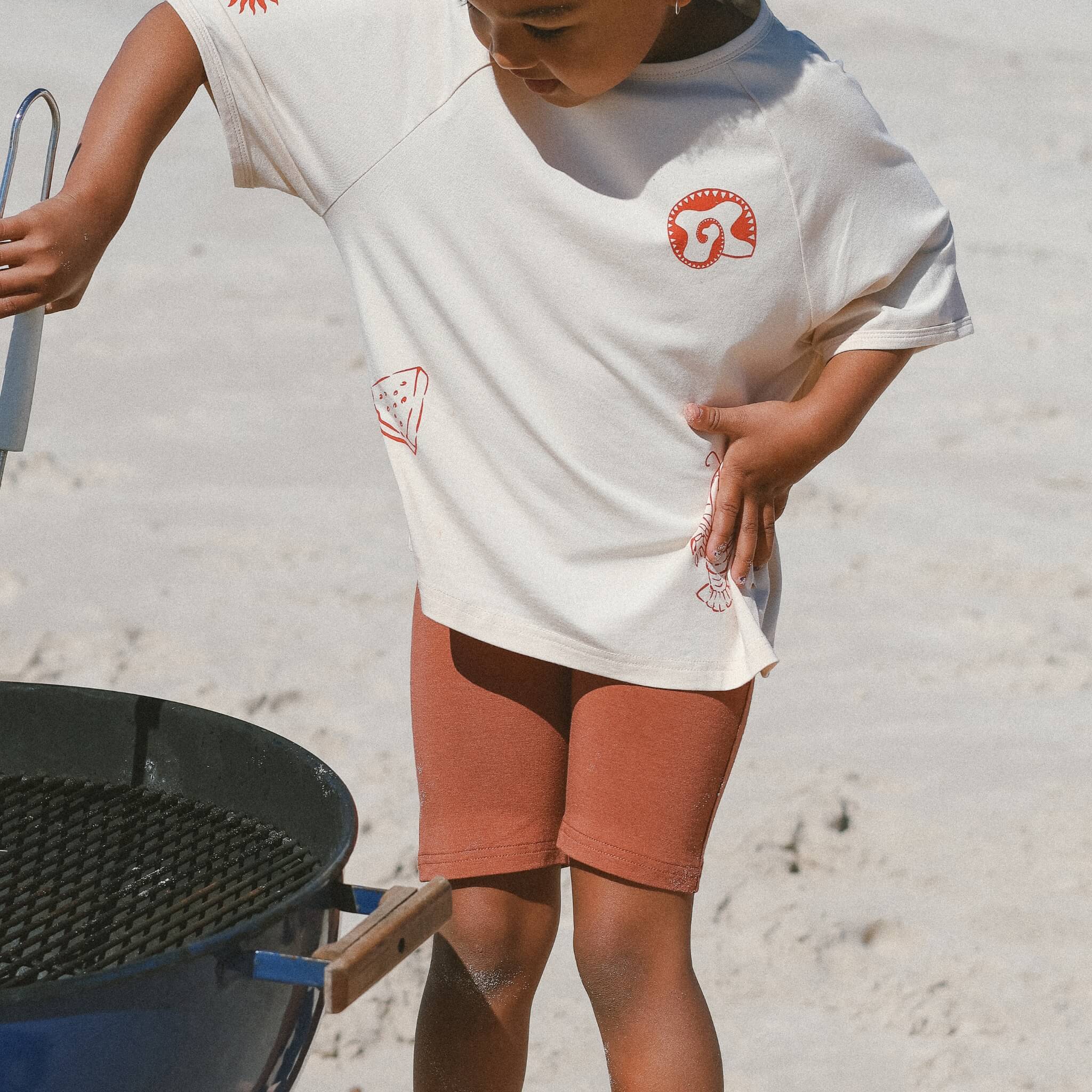 child-wearing-rust-bike-pants-cream-tee-bamboo