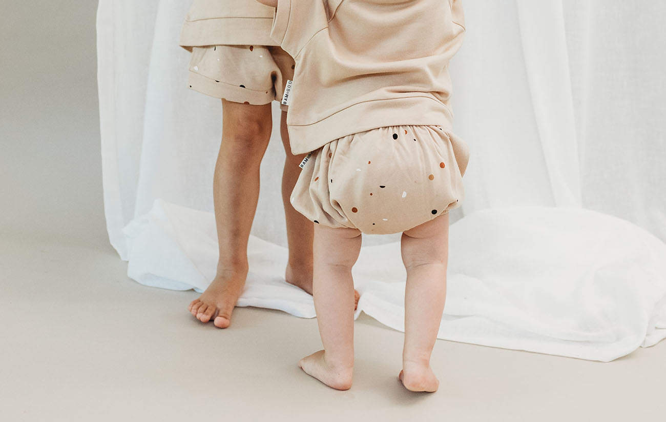 Terrazzo printed baby fleece Bumbums in beige by Bam Loves Boo