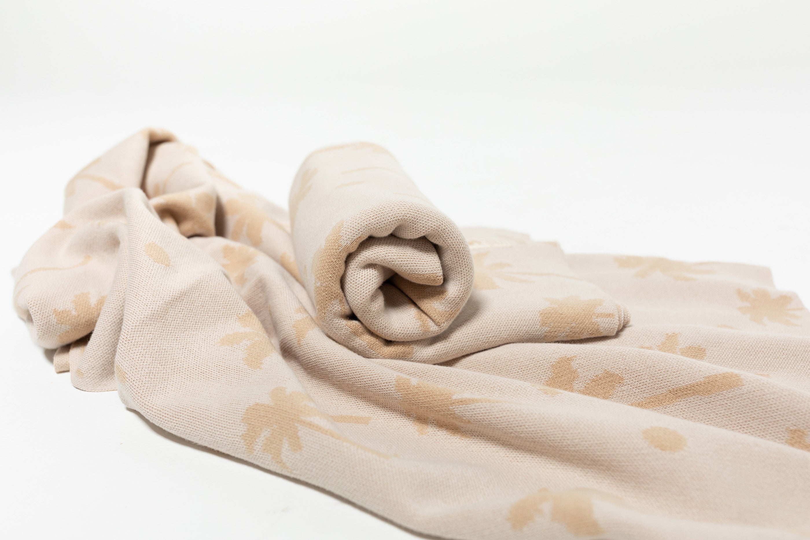 Baby Wrapped in Organic Cotton blanket with Palm tree jacquard by Bam Loves Boo