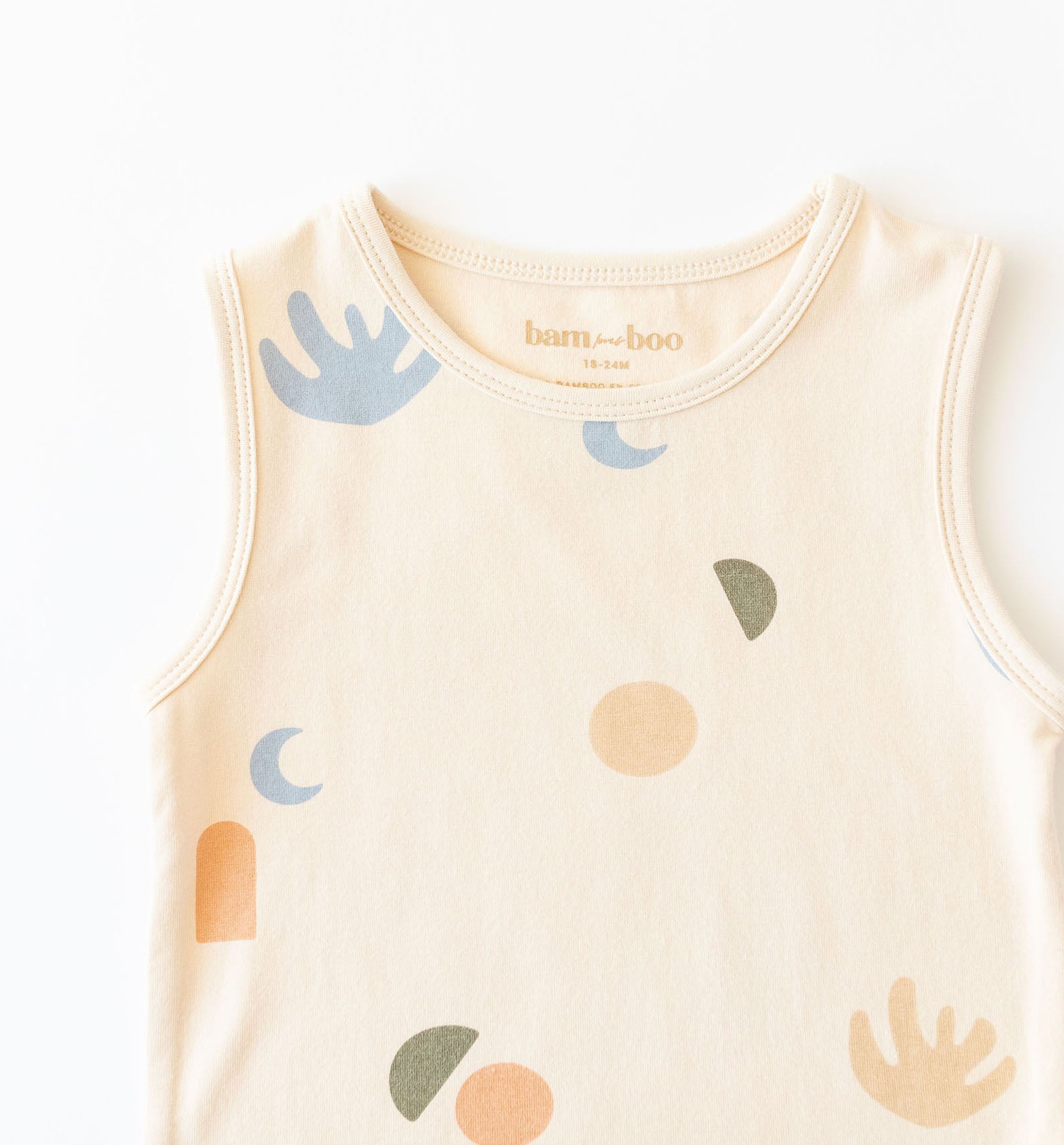 Cream baby onesie with multi coloured elements print by Bam Loves Boo