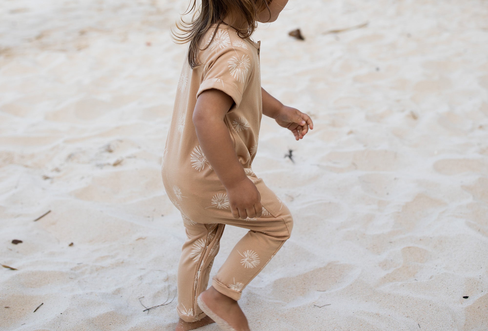 Short sleeve baby Jumpsuit with all over palm print in honey colour by Bam Loves Boo