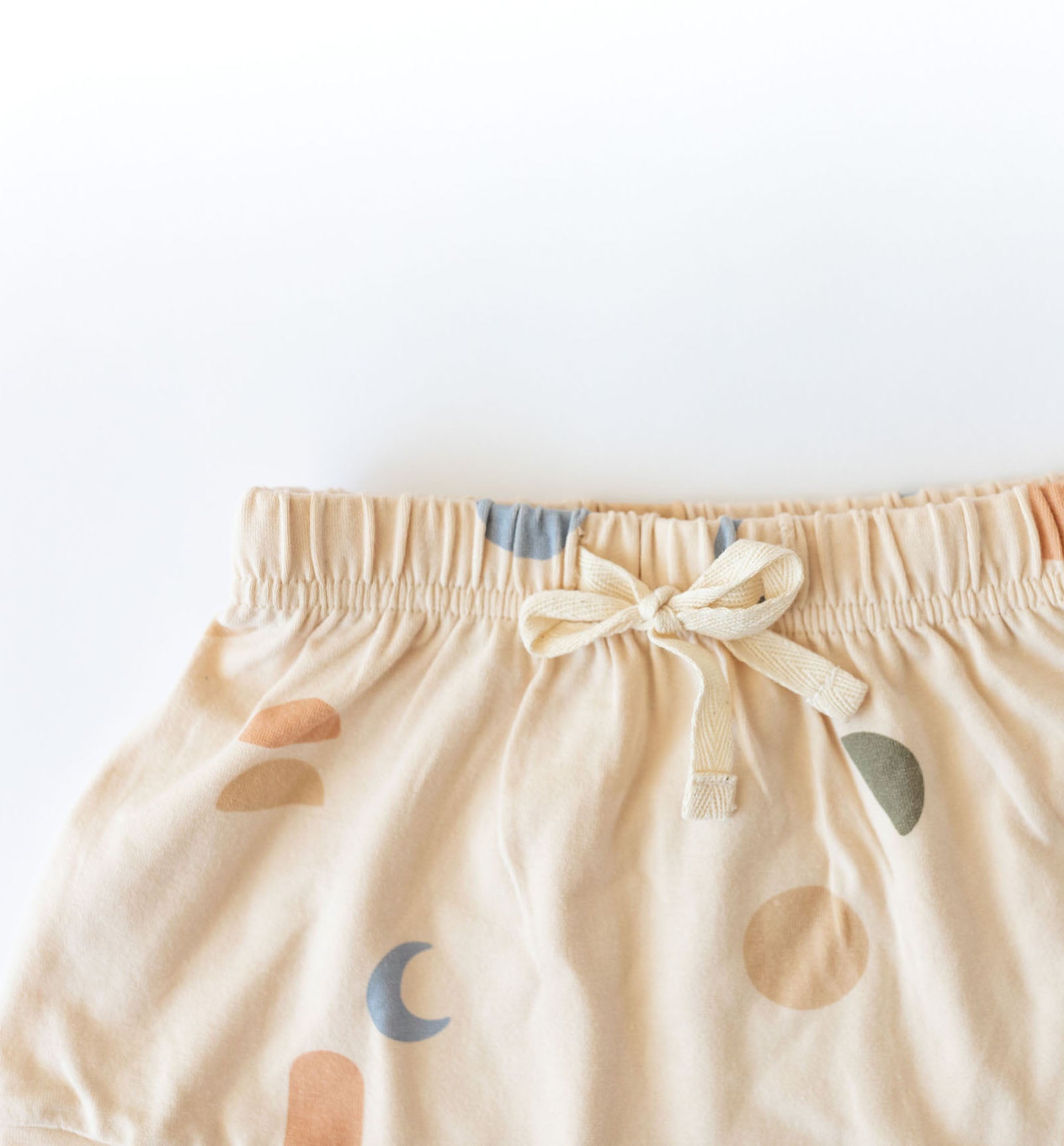 Cream coloured kids shorts with multi coloured elements print by Bam loves Boo