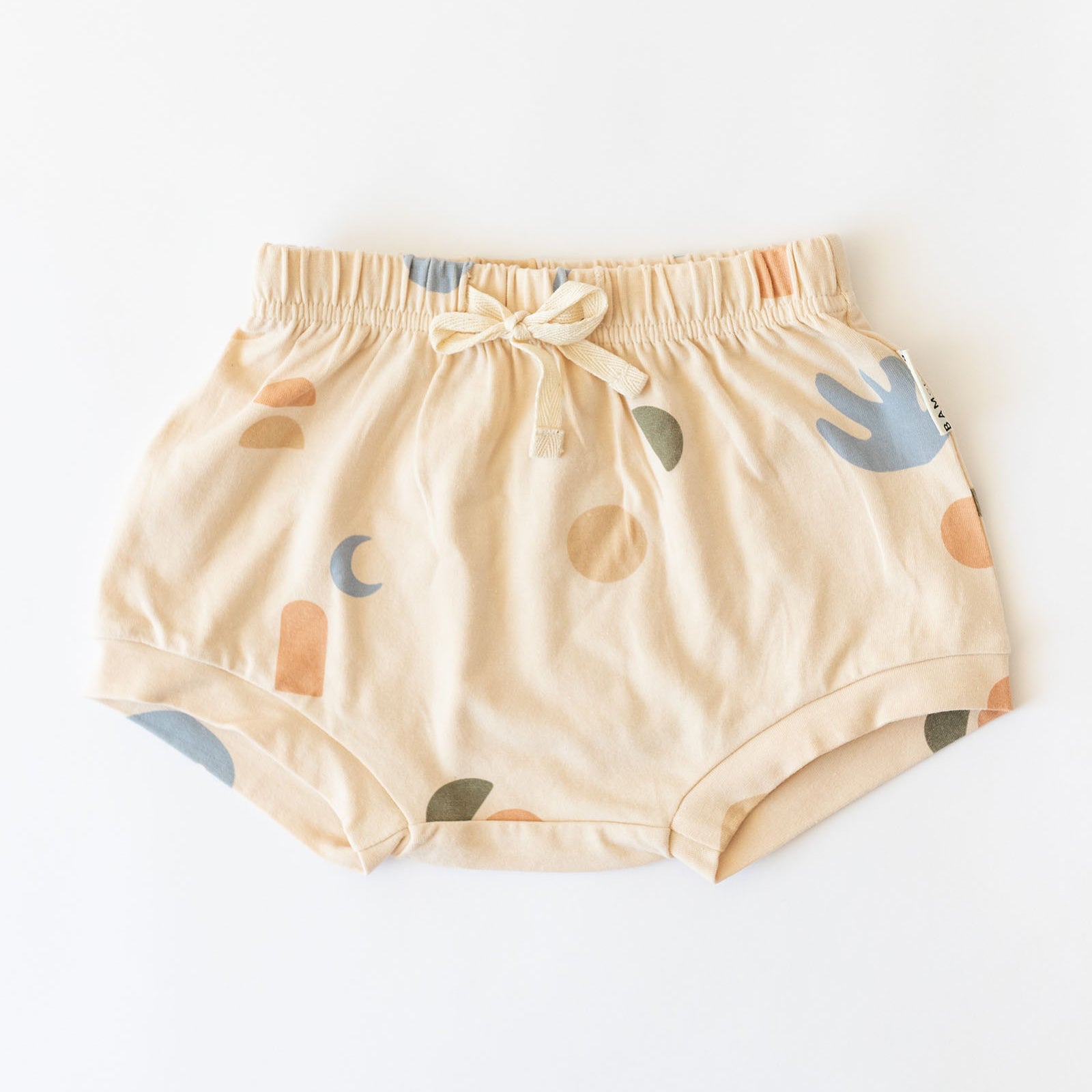 Cream coloured kids shorts with multi coloured elements print by Bam loves Boo