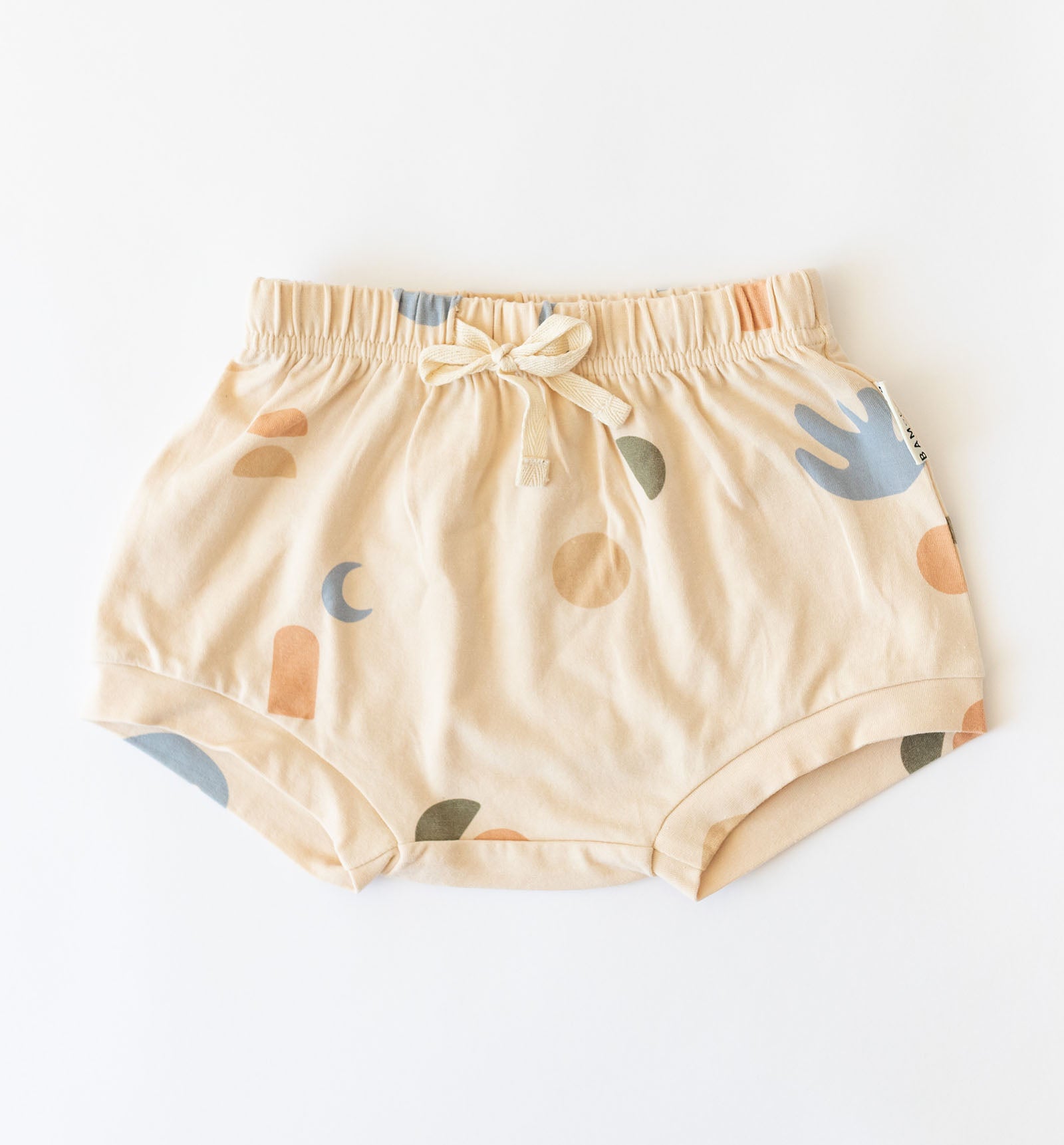 Cream coloured kids shorts with multi coloured elements print by Bam loves Boo