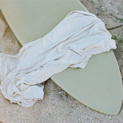Stripe Swaddle on surf board by Bam Loves Boo